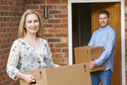 Professional movers transporting household items for an Enfield relocation
