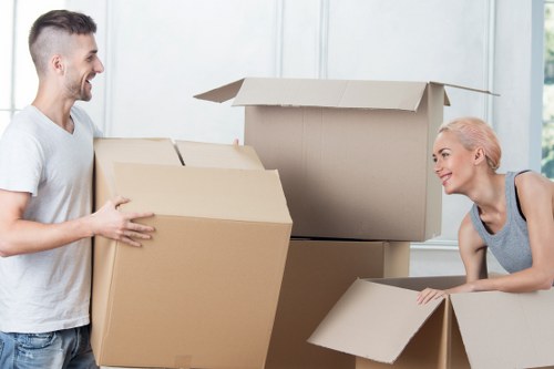 Packed office boxes and equipment ready for transport during a commercial move