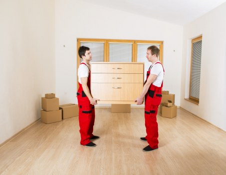 Piano being safely loaded onto a removals vehicle for transport
