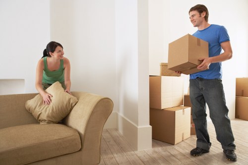 Local movers transporting sofas and cabinets in Enfield